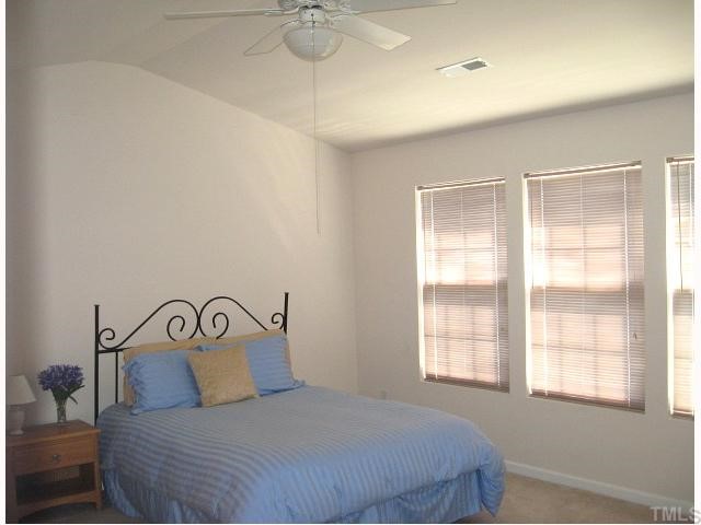5251 Little Sandy Drive Raleigh, NC 27616 - Photo 7 of 12 Master suite with cathedral ceiling, ceiling fan, & walk-in closet
