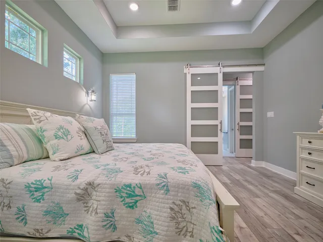 a bedroom with a bed and a cabinets