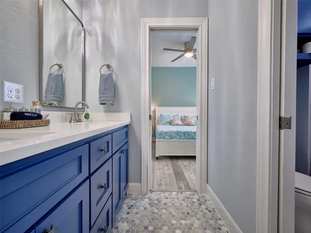 a bathroom with a sink a vanity and a mirror