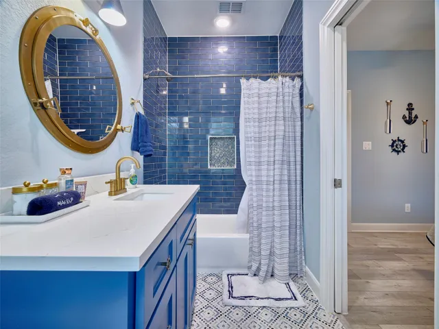 a bathroom with a sink a vanity and a mirror