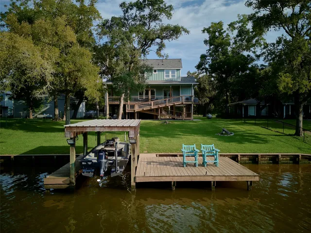 a view of a lake with a house in the background