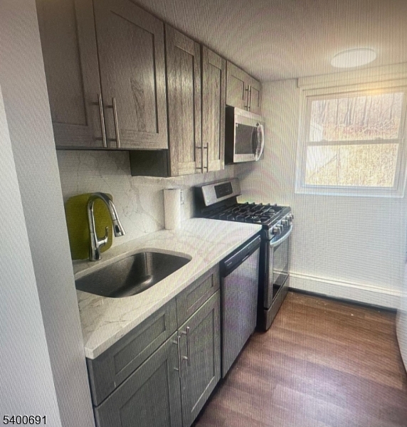 22 Spring Lane Long Valley, NJ 07853 - Photo 4 of 12 a kitchen with stainless steel appliances granite countertop a sink stove and microwave
