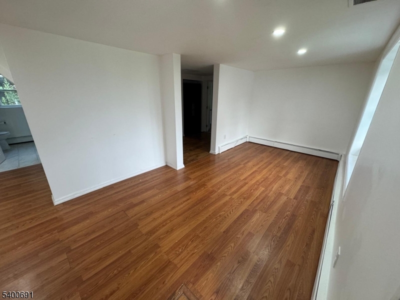 22 Spring Lane Long Valley, NJ 07853 - Photo 9 of 12 a view of empty room with wooden floor