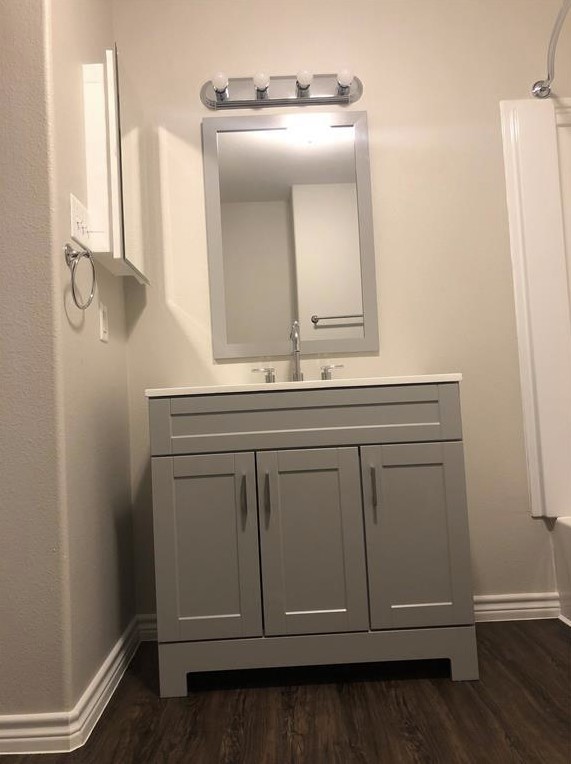 212 Gulf Pump Road, Unit C Crosby, TX 77532 - Photo 11 of 14 a bathroom with a sink and a mirror