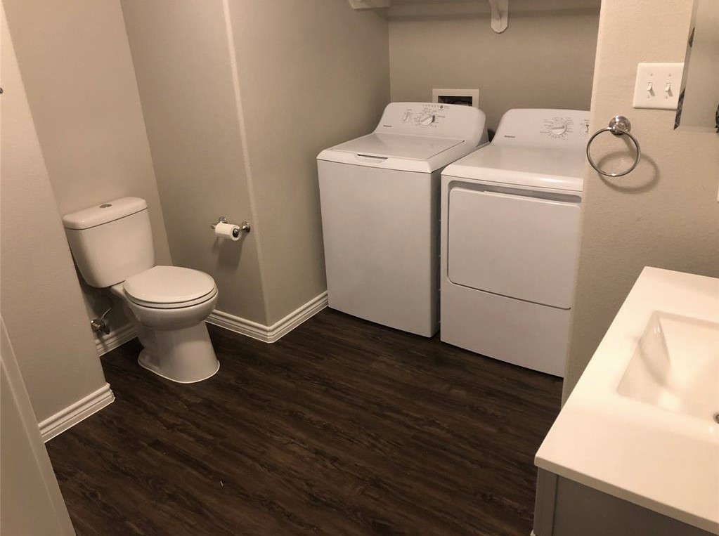 212 Gulf Pump Road, Unit C Crosby, TX 77532 - Photo 14 of 14 a view of a bathroom with a washer and dryer