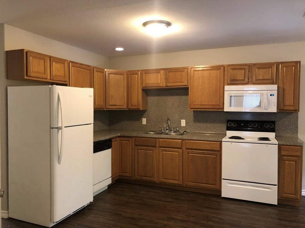 212 Gulf Pump Road, Unit C Crosby, TX 77532 - Photo 5 of 14 a white refrigerator freezer sitting in a kitchen