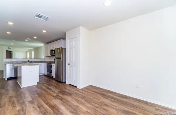 a view of kitchen with wooden floor