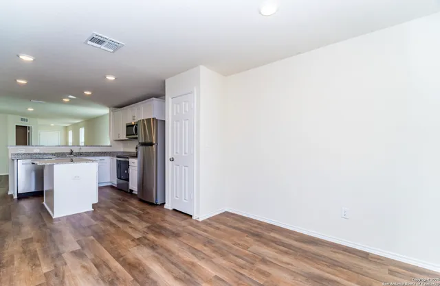 a view of kitchen with wooden floor
