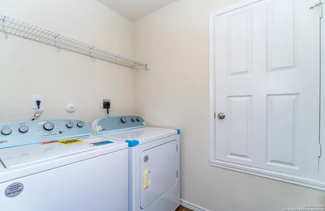 a utility room with dryer and washer