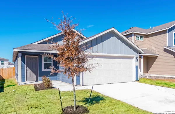 a backyard of a house with seating space