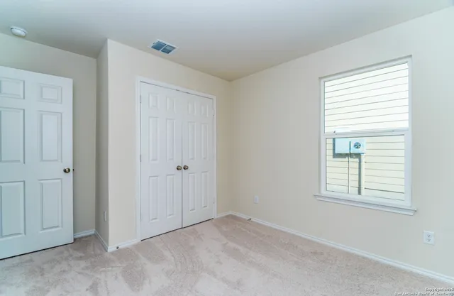 a bathroom with a sink toilet vanity and shower