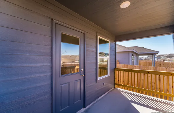 a view of a house with backyard and porch