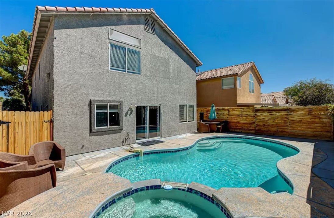 This outdoor oasis offers a refreshing pool and spa, perfect for relaxation and entertaining.