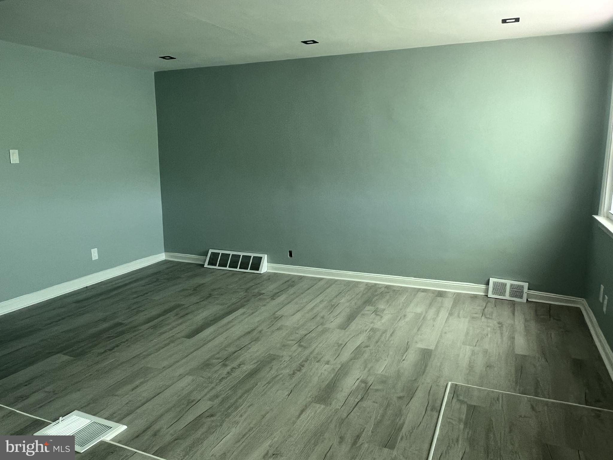 6526 Keystone Street Philadelphia, PA 19135 - Photo 3 of 7 an empty room with wooden floor