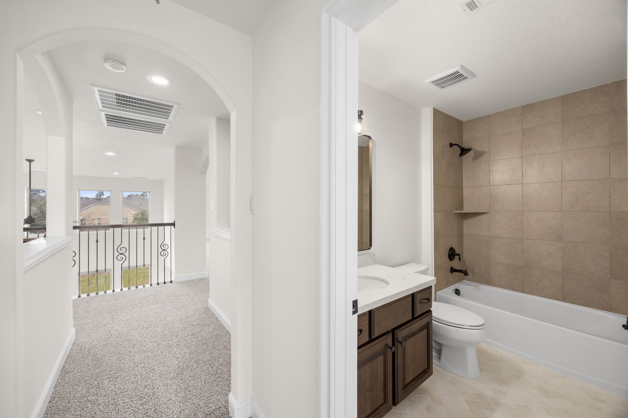 8551 Tombron Grove Road Magnolia, TX 77354 - Photo 40 of 49 Secondary bathroom and hallway upstairs.