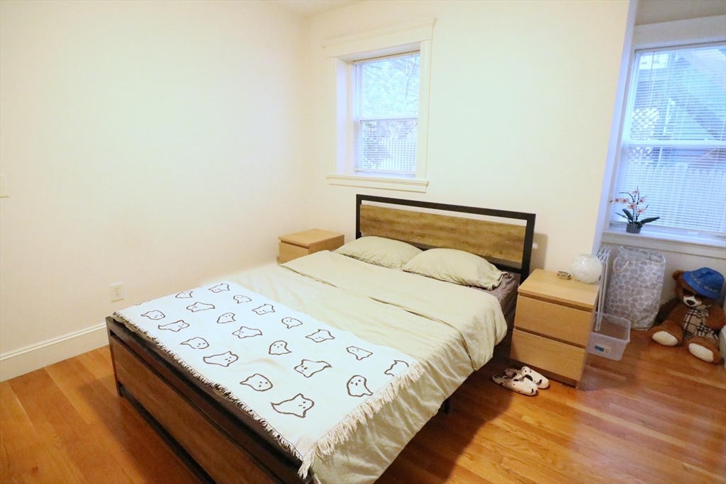 30 Upland Road, Unit 4 Cambridge, MA 02140 - Photo 3 of 14 a bedroom with a bed and a window