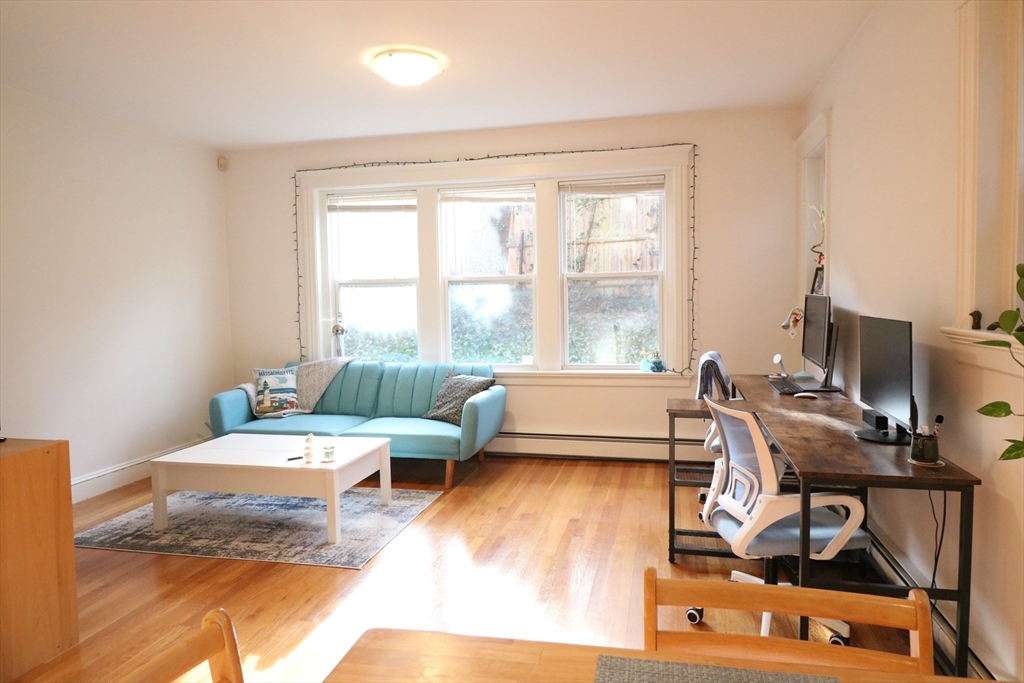 30 Upland Road, Unit 4 Cambridge, MA 02140 - Photo 6 of 14 a living room with furniture and a window