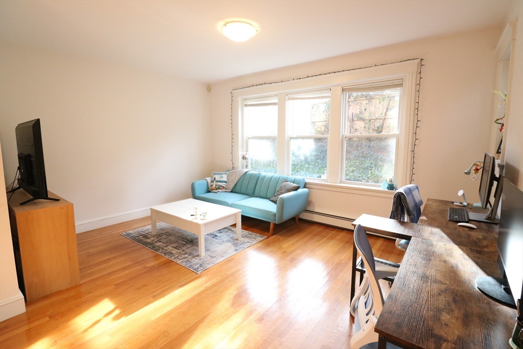 30 Upland Road, Unit 4 Cambridge, MA 02140 - Photo 7 of 14 a living room with furniture and a window