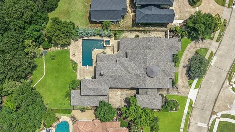 an aerial view of a house with outdoor space and street view