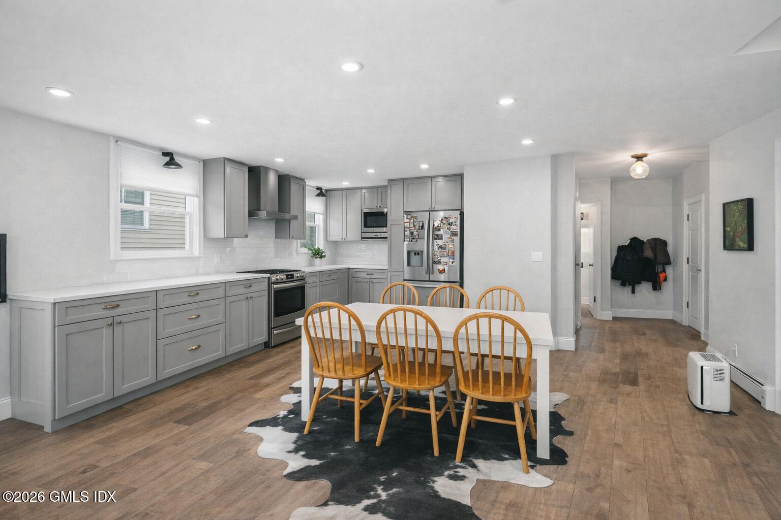37 Prospect Street Greenwich, CT 06830 - Photo 19 of 41 a kitchen with a dining table chairs and view living room