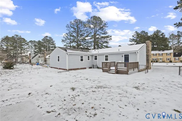a view of a house with a snow in the yard