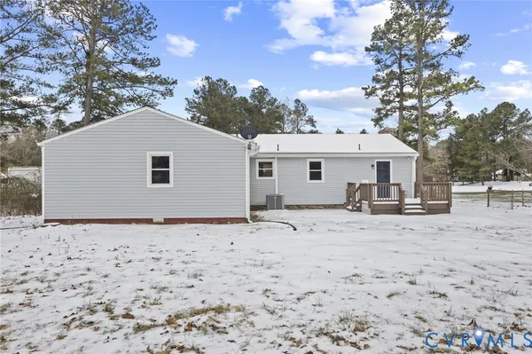 a view of a house with a snow in the background