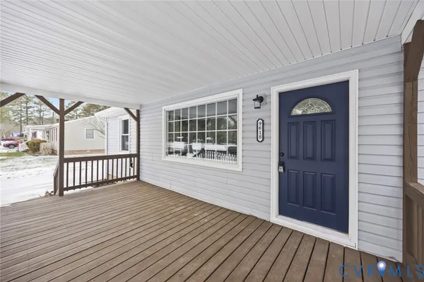a view of an entryway with wooden floor
