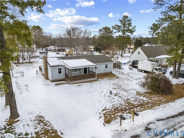 a view of a town with large trees