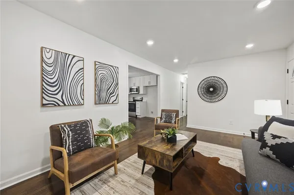 a living room with furniture and a clock