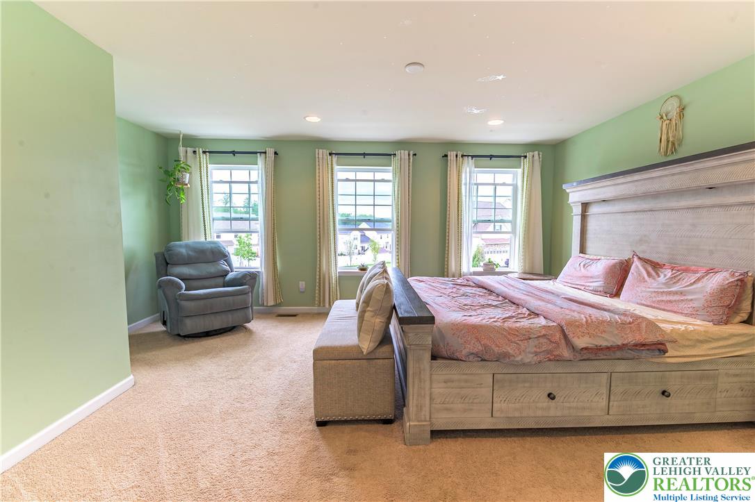 3892 Mink Road Emmaus, PA 18049 - Photo 20 of 39 a spacious bedroom with a bed and a couch