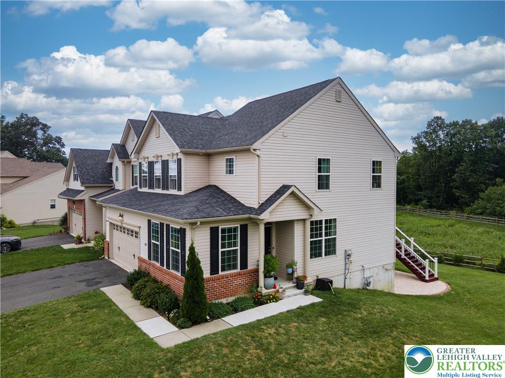 3892 Mink Road Emmaus, PA 18049 - Photo 2 of 39 a front view of a house with a yard