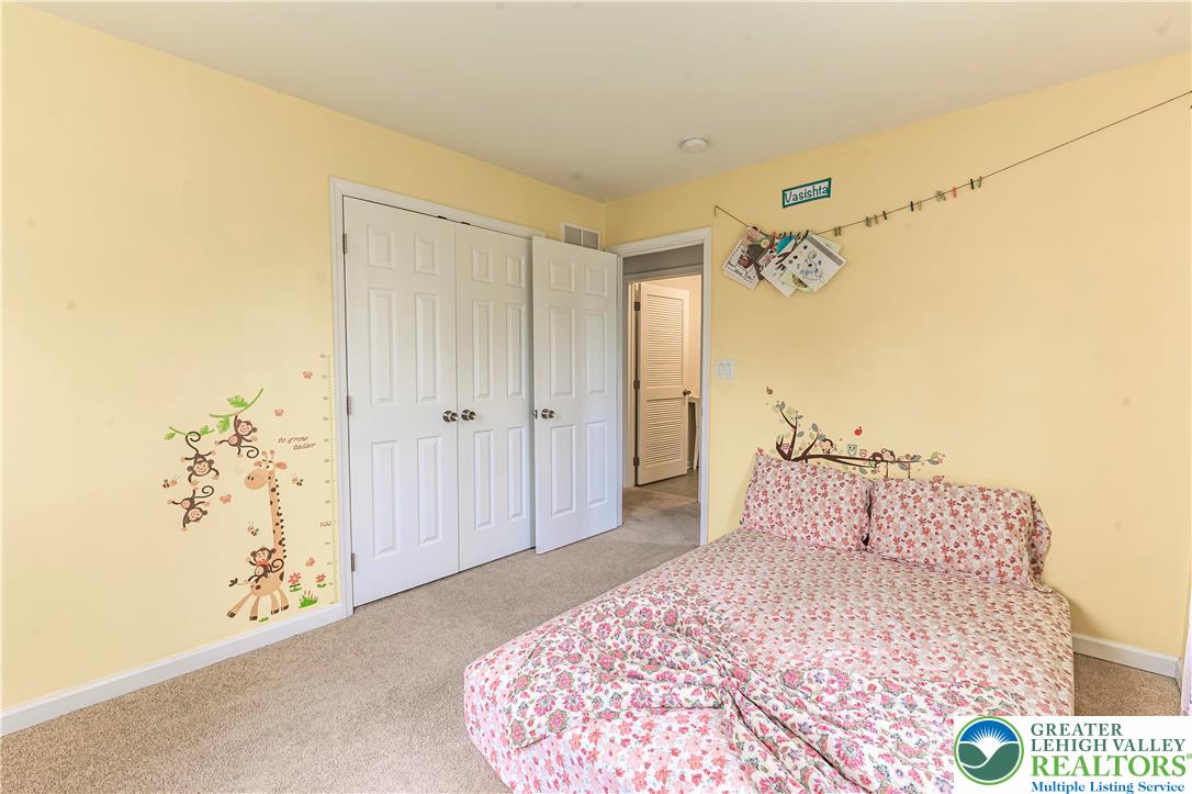 3892 Mink Road Emmaus, PA 18049 - Photo 25 of 39 a bedroom with a bed and a mirror