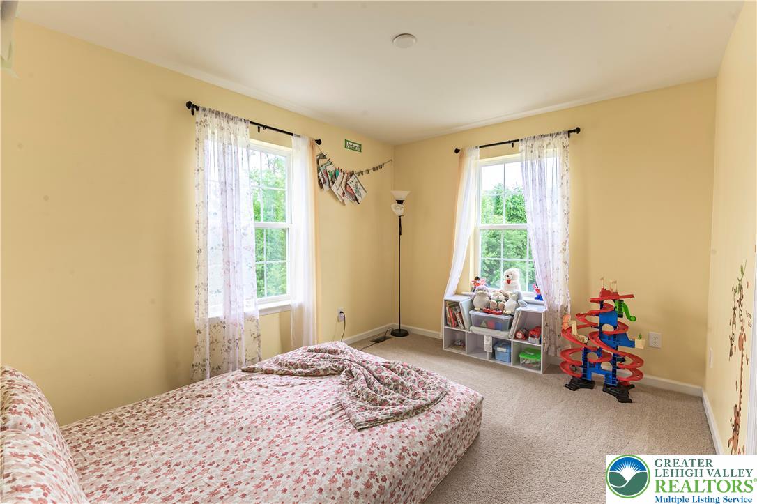 3892 Mink Road Emmaus, PA 18049 - Photo 26 of 39 a bedroom with a bed and a window