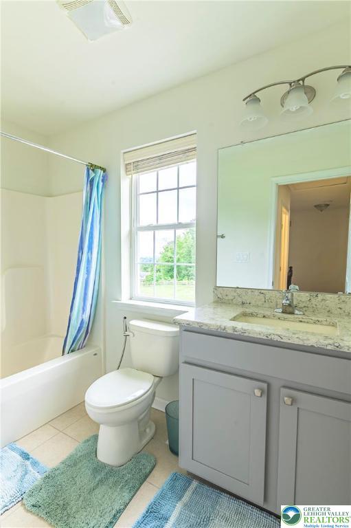 3892 Mink Road Emmaus, PA 18049 - Photo 27 of 39 a bathroom with a granite countertop sink toilet a large mirror a bathtub and next to a window