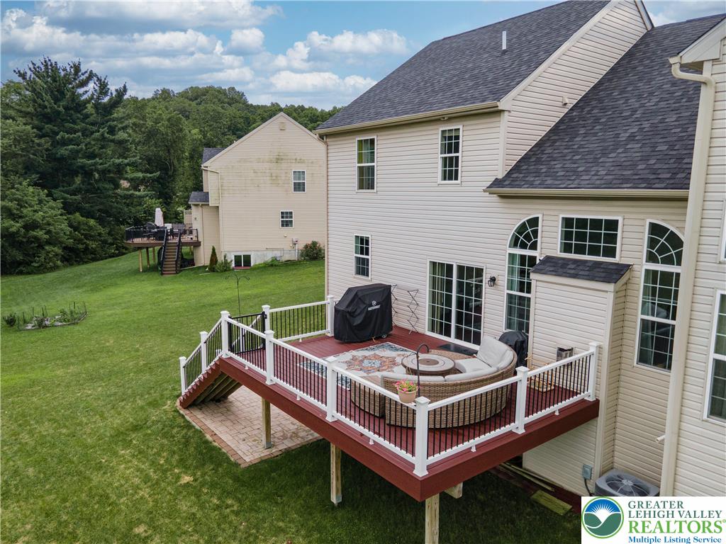 3892 Mink Road Emmaus, PA 18049 - Photo 29 of 39 a view of a lounge chair in the backyard of the house