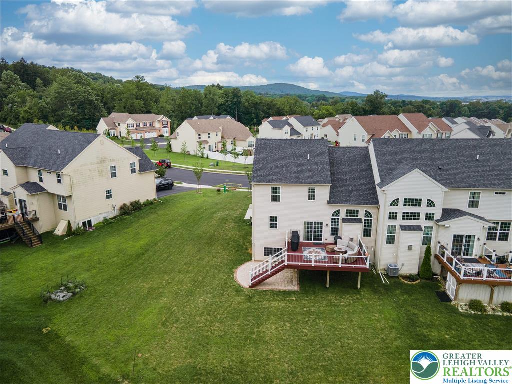 3892 Mink Road Emmaus, PA 18049 - Photo 32 of 39 an aerial view of a house with swimming pool and a garden