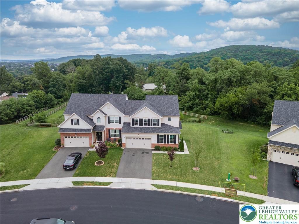 3892 Mink Road Emmaus, PA 18049 - Photo 38 of 39 an aerial view of a house with a garden and trees