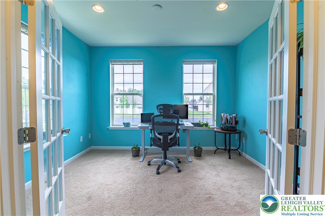 3892 Mink Road Emmaus, PA 18049 - Photo 4 of 39 a view of a workspace with furniture and a window