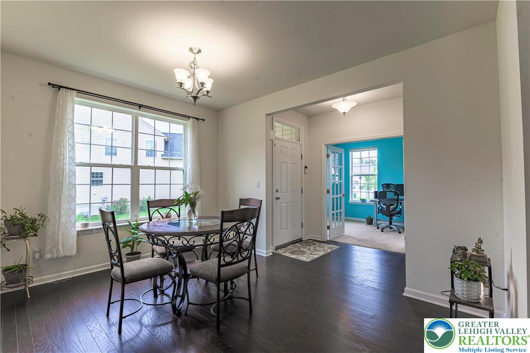 3892 Mink Road Emmaus, PA 18049 - Photo 6 of 39 a view of a dining room with furniture window and wooden floor