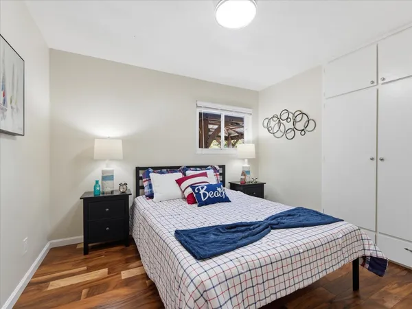 a bedroom with a bed and a table