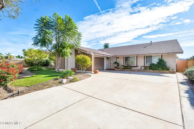 a house view with a garden space