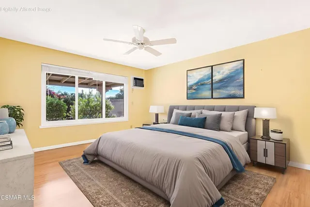 a bedroom with a large bed and a window