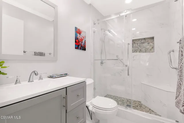 a view of a dining room with a table and chairs