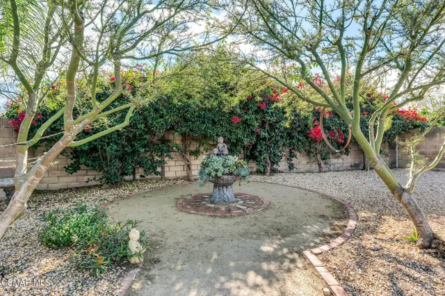 a view of house with backyard