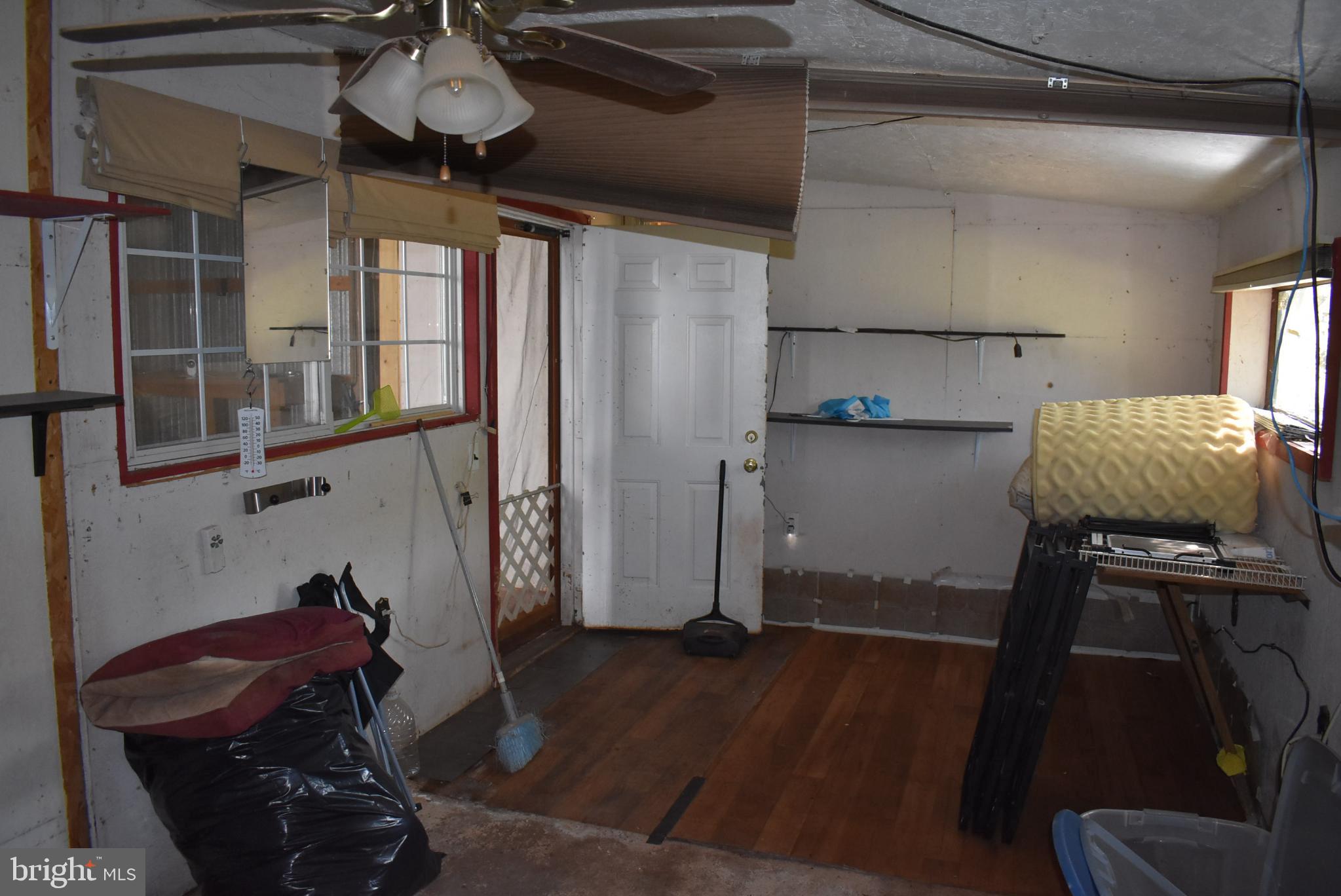 1971 Duckwall Road Berkeley Springs, WV 25411 - Photo 20 of 64 a room with wooden floor and furniture