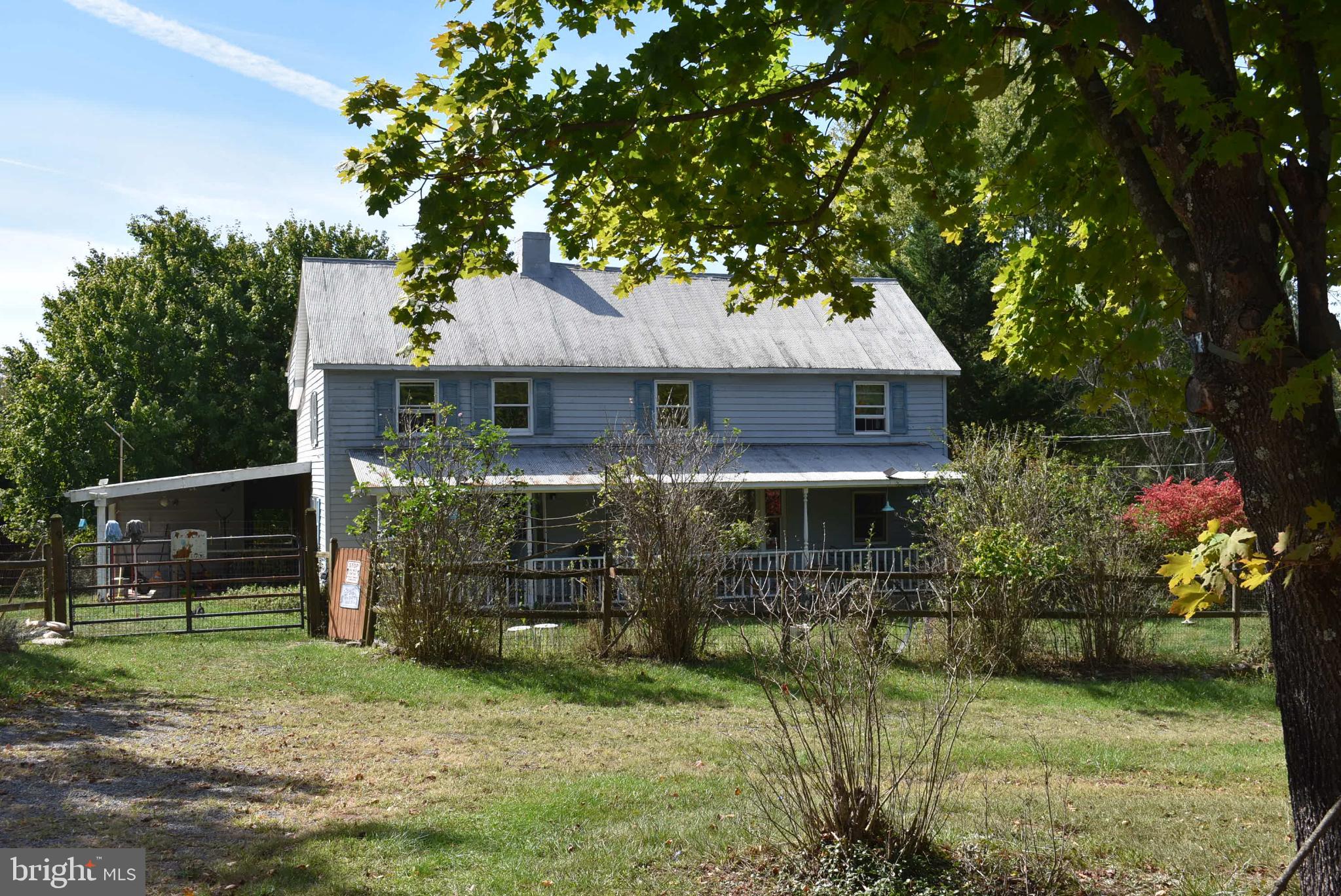 1971 Duckwall Road Berkeley Springs, WV 25411 - Photo 23 of 64 a front view of a house with garden