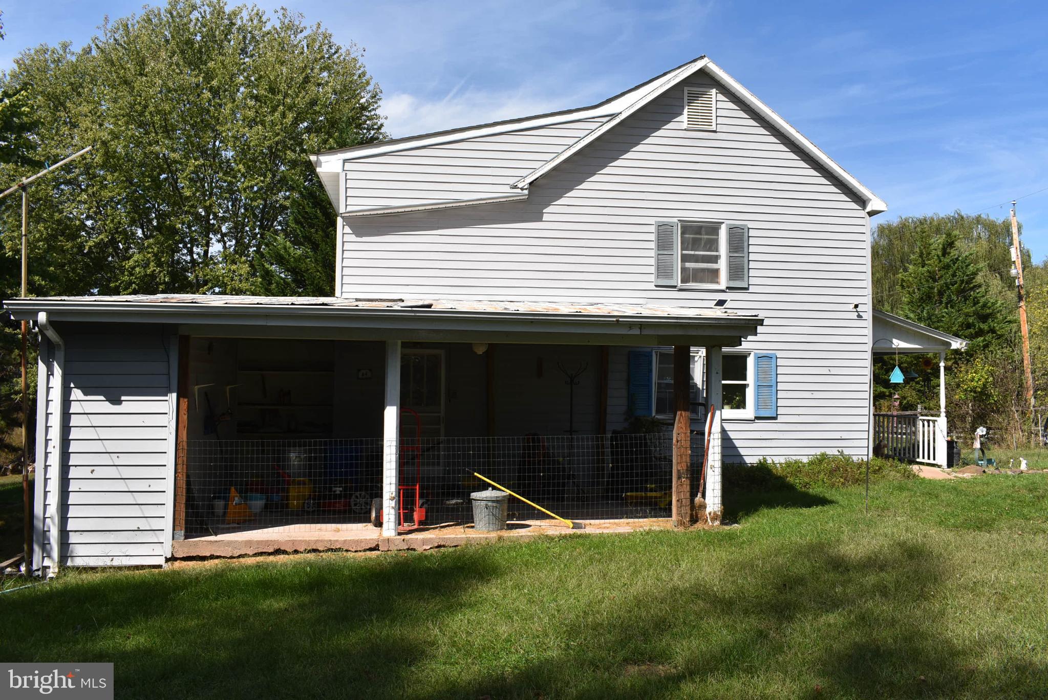1971 Duckwall Road Berkeley Springs, WV 25411 - Photo 25 of 64 a front view of a house with a yard