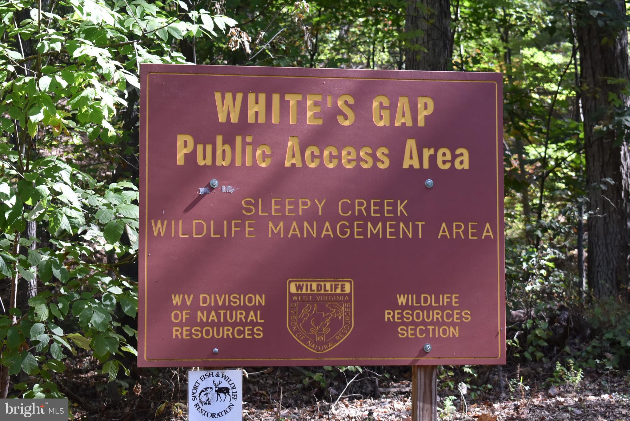 1971 Duckwall Road Berkeley Springs, WV 25411 - Photo 4 of 64 a sign that is on a brick wall