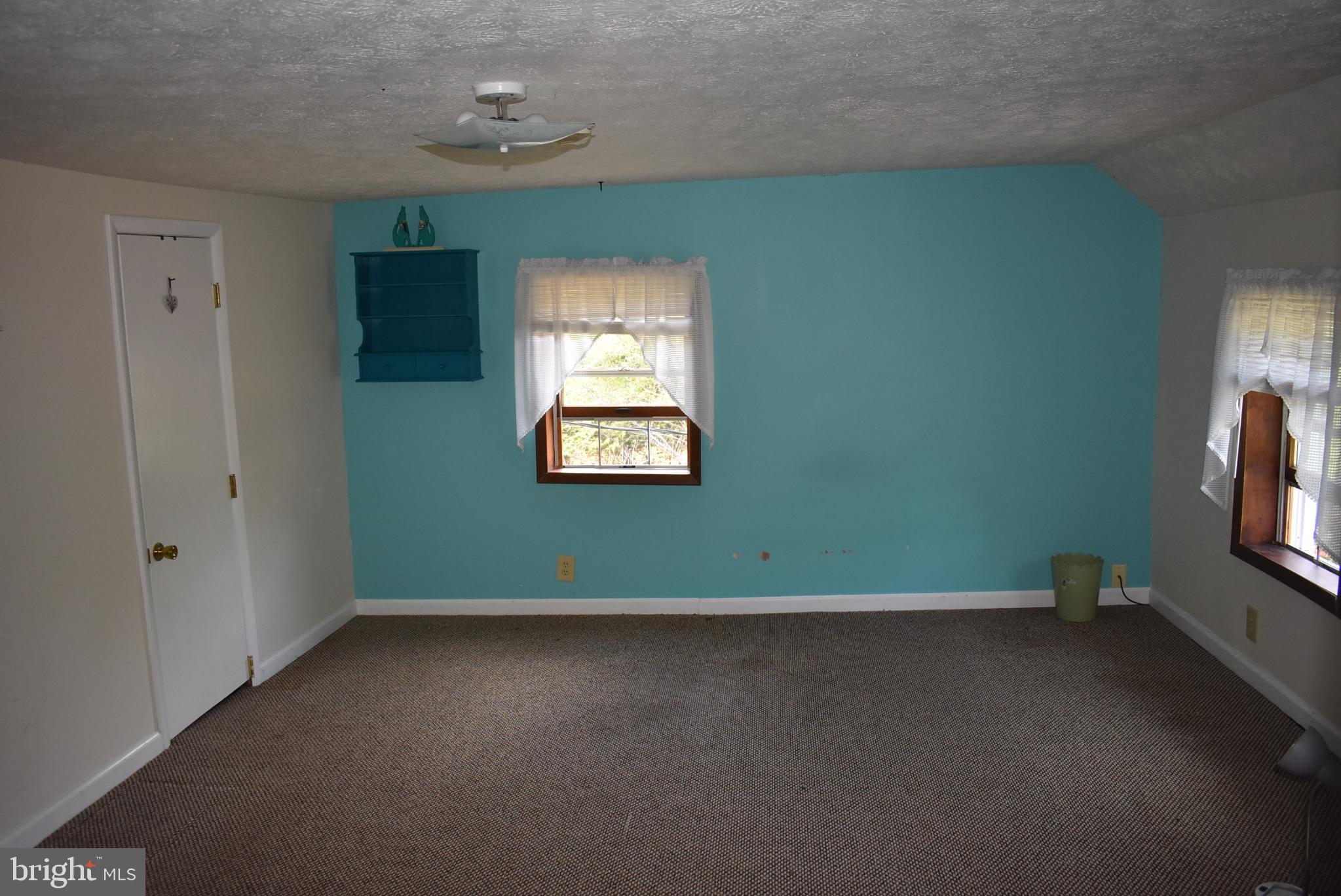 1971 Duckwall Road Berkeley Springs, WV 25411 - Photo 42 of 64 Bright and airy room with charming accents.