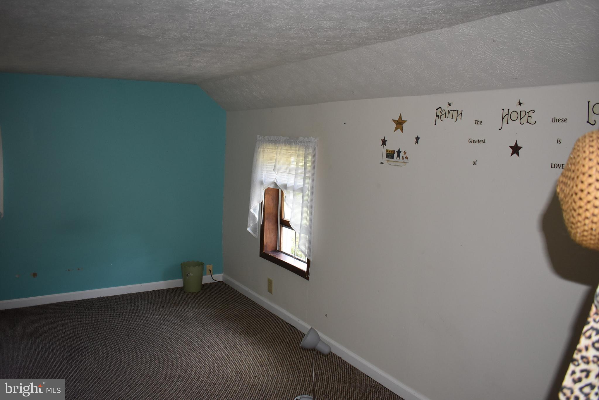 1971 Duckwall Road Berkeley Springs, WV 25411 - Photo 43 of 64 view of room with window and hallway
